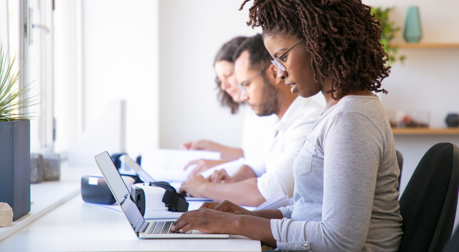 Two team members reviewing the platform together on a laptop